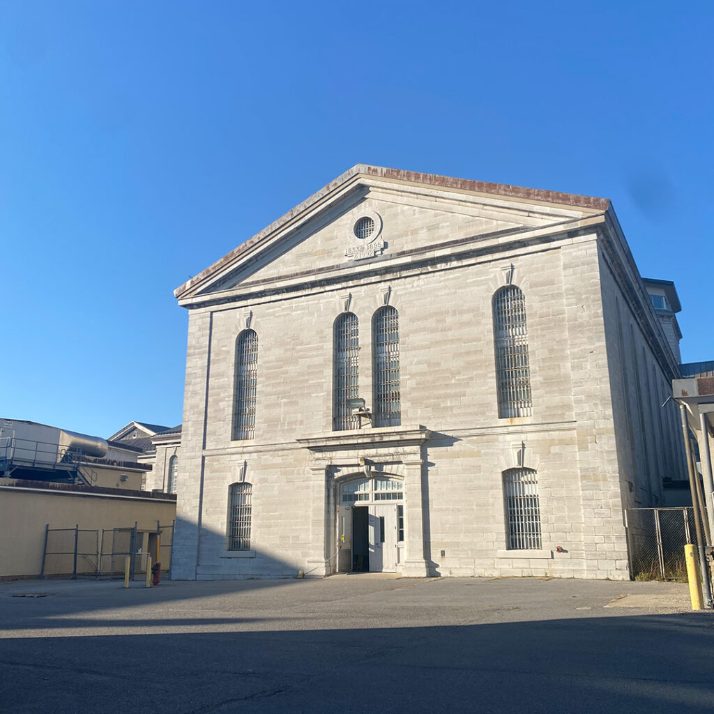 Large, almost gothic style, concrete building that is administrative taken during a kingston pen tours